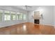 Bright living room with fireplace, hardwood floors, and many windows at 7801 Kingsbrook Ct, Wake Forest, NC 27587