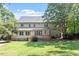 Rear of house with a deck and a spacious backyard at 7801 Kingsbrook Ct, Wake Forest, NC 27587