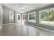 Bright sunroom with tile flooring, vaulted ceiling, and access to backyard at 7801 Kingsbrook Ct, Wake Forest, NC 27587