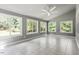 Bright sunroom with tile floor and many windows at 7801 Kingsbrook Ct, Wake Forest, NC 27587