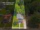 Approximate property lines of a charming home with a welcoming front porch surrounded by lush greenery at 813 N Main St, Burlington, NC 27217
