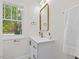 Stylish bathroom vanity area with modern gold fixtures at 813 N Main St, Burlington, NC 27217
