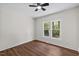 A sunlit bedroom offers wood-look floors and a ceiling fan at 813 N Main St, Burlington, NC 27217