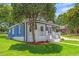 Charming home with a inviting front porch and blue siding at 813 N Main St, Burlington, NC 27217
