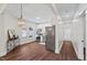 Modern kitchen with stainless steel appliances, stylish light fixture, and ample counter space at 813 N Main St, Burlington, NC 27217