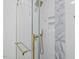 Luxurious shower with elegant tile and gold fixtures at 813 N Main St, Burlington, NC 27217