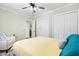 Inviting bedroom featuring a ceiling fan, double closets, and comfortable furnishings at 815 Daniels St # A, Raleigh, NC 27605