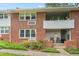 Charming brick apartment building with a covered balcony and well-maintained landscaping at 815 Daniels St # A, Raleigh, NC 27605