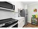Well-equipped kitchen features stainless steel appliances, subway tile backsplash, and stylish fixtures at 815 Daniels St # A, Raleigh, NC 27605