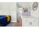 Open-concept living room with an adjacent dining area and modern white cabinetry at 815 Daniels St # A, Raleigh, NC 27605