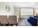 Bright living room with a dining area, large window, and hardwood floors at 815 Daniels St # A, Raleigh, NC 27605