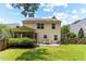 Backyard featuring a covered patio with outdoor seating, ideal for entertaining and enjoying the outdoors at 822 Blue Lake Dr, Mebane, NC 27302