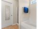 This bathroom includes a door with a mirror, as well as a shower and bathtub at 822 Blue Lake Dr, Mebane, NC 27302