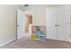 Bedroom featuring organized shelving with colorful baskets and a convenient double door closet for ample storage at 822 Blue Lake Dr, Mebane, NC 27302