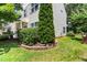 Landscaped home exterior showcasing green bushes and plants for added curb appeal at 822 Blue Lake Dr, Mebane, NC 27302