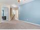 Spacious loft area featuring plush carpeting and access to multiple rooms, ideal for a flexible living space at 822 Blue Lake Dr, Mebane, NC 27302