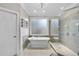 This bathroom has a luxurious soaking tub, and large glass enclosed shower at 8416 Davishire Dr, Raleigh, NC 27615
