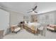 Calm and inviting bedroom with a ceiling fan, neutral paint, shuttered windows and stylish furnishings at 8416 Davishire Dr, Raleigh, NC 27615