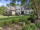 Charming two-story home with stone accents, manicured lawn, and lush landscaping at 8416 Davishire Dr, Raleigh, NC 27615
