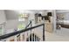 Open hallway with a chandelier, staircase, and a light wooden console table at 8416 Davishire Dr, Raleigh, NC 27615