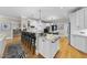 Spacious kitchen with large island, breakfast bar, granite countertops, and modern appliances at 8416 Davishire Dr, Raleigh, NC 27615