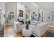 Living room boasts high ceilings, a fireplace, built-in shelving, and large windows at 8416 Davishire Dr, Raleigh, NC 27615