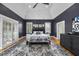 Main bedroom features vaulted ceiling, hardwood floors, plantation shutters, and stylish furnishings at 8416 Davishire Dr, Raleigh, NC 27615
