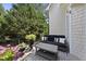 Cozy outdoor patio with a comfortable sofa, table and lush landscaping at 8416 Davishire Dr, Raleigh, NC 27615