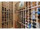 Climate-controlled wine cellar with wooden racking to showcase your extensive wine collection at 8416 Davishire Dr, Raleigh, NC 27615