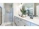 Beautiful bathroom featuring double sinks, white cabinetry, and decorative accents at 88 Freedom Heights Ln # 148, Smithfield, NC 27577