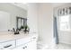 Neat bathroom featuring white cabinets, stylish fixtures, and shower at 88 Freedom Heights Ln # 148, Smithfield, NC 27577