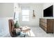 Relaxing bonus room featuring stylish decor and an entertainment setup with TV and guitar at 88 Freedom Heights Ln # 148, Smithfield, NC 27577