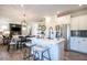 Open concept living space featuring a kitchen island, stainless steel appliances and wood floors at 88 Freedom Heights Ln # 148, Smithfield, NC 27577