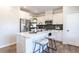 Bright kitchen with stainless appliances, island, white cabinets and modern finishes at 88 Freedom Heights Ln # 148, Smithfield, NC 27577