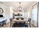 Eat-in kitchen with wood table, decorative lighting, and an adjacent office space at 88 Freedom Heights Ln # 148, Smithfield, NC 27577