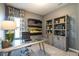 Inviting office space with modern desk, stylish shelving, and ample natural light at 88 Freedom Heights Ln # 148, Smithfield, NC 27577