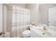 Well-lit bathroom featuring a shower-tub combination and a modern vanity with a white countertop sink at 904 E Ivy Valley Dr, Fuquay Varina, NC 27526
