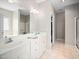 Bright bathroom with dual sinks, soaking tub, and separate shower, offering a spa-like experience for relaxation and comfort at 904 E Ivy Valley Dr, Fuquay Varina, NC 27526