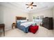 Calm main bedroom with tray ceiling, a plush bed, and natural light providing a relaxing and private retreat at 904 E Ivy Valley Dr, Fuquay Varina, NC 27526