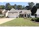 Charming single-story home featuring a two-car garage, well-manicured lawn, and inviting landscaping at 904 E Ivy Valley Dr, Fuquay Varina, NC 27526