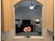 Open archway from kitchen showing the living room with plush seating and a serene atmosphere filled with natural light at 904 E Ivy Valley Dr, Fuquay Varina, NC 27526