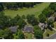Aerial view of a beautiful neighborhood featuring mature trees, well-maintained homes, and lush landscaping for serene living at 904 Parkridge Dr, Clayton, NC 27527