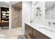 Contemporary bathroom featuring a walk-in shower, double vanity, and stylish fixtures with ample natural light at 904 Parkridge Dr, Clayton, NC 27527