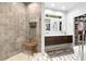 Modern bathroom with a tiled walk-in shower, double vanity, and soaking tub, creating a spa-like experience at 904 Parkridge Dr, Clayton, NC 27527