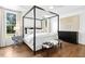 Bright and airy bedroom featuring hardwood floors and a large window offering serene views and natural light at 904 Parkridge Dr, Clayton, NC 27527