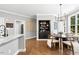 Charming breakfast nook featuring cozy seating, backyard views, and hardwood flooring at 904 Parkridge Dr, Clayton, NC 27527