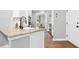 Kitchen with sleek countertops, modern sink, stainless steel appliances, and hardwood flooring at 904 Parkridge Dr, Clayton, NC 27527