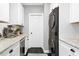 Modern kitchen featuring stainless steel appliances, sleek countertops, and ample cabinet space and in-unit washer/dryer at 904 Parkridge Dr, Clayton, NC 27527