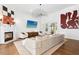 Bright living room with a fireplace and views of the yard with hardwood floors and stylish décor at 904 Parkridge Dr, Clayton, NC 27527