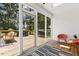Bright sunroom featuring large glass doors that seamlessly connect with the deck at 904 Parkridge Dr, Clayton, NC 27527